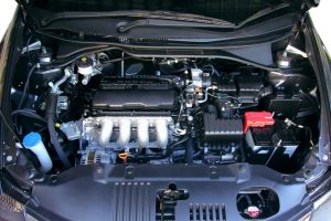 Close-up view of a Hyundai I45 engine with the hood open, showcasing the engine block for reference on engine size.